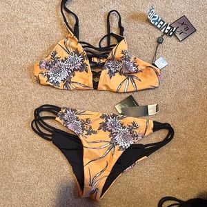 Never worn bathing suit. Size medium